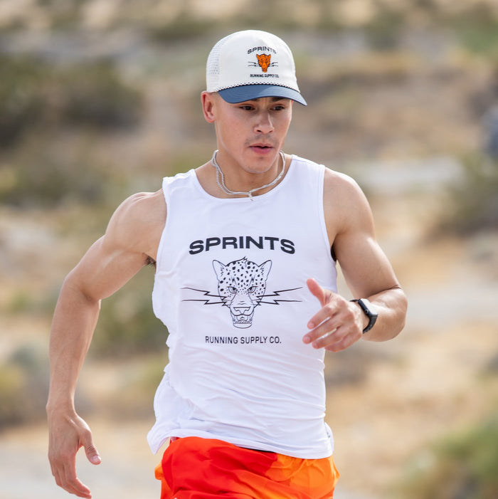Man wearing the Core Zero Running Tank in Vault Jag White, close-up
