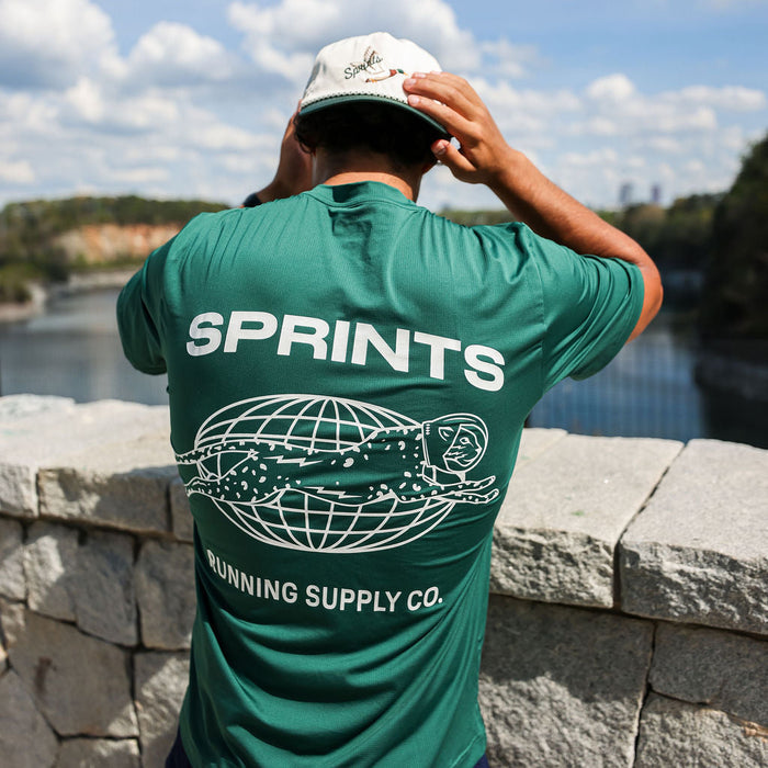 Man wearing the Core Zero Tech Tee in Miles Worldwide print