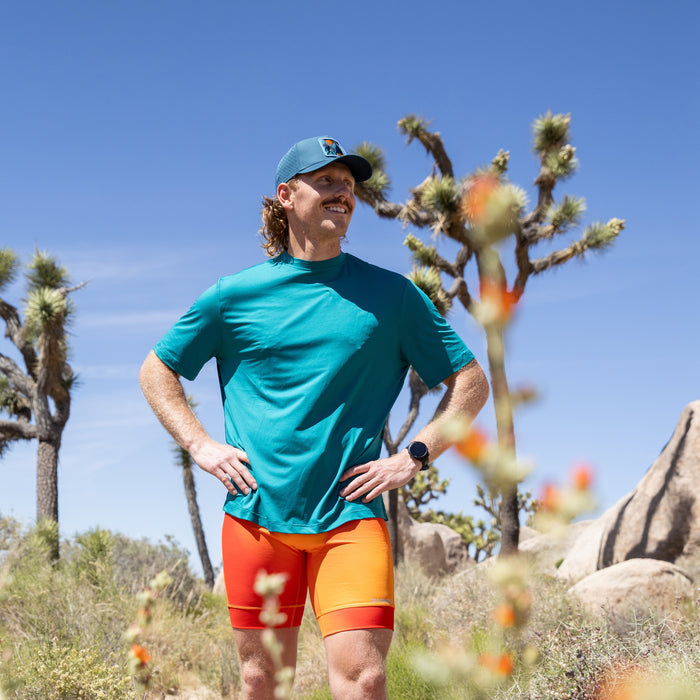 Man wearing the Core Zero Tech Tee in Sasquatch print, running