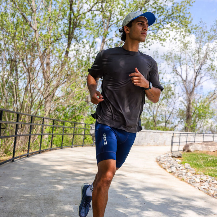 Man wearing the Core Zero Tech Tee in Vault Jag Charcoal, side view