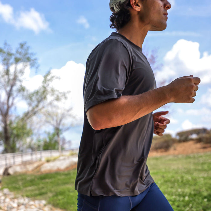 Man wearing the Core Zero Tech Tee in Vault Jag Charcoal, close-up