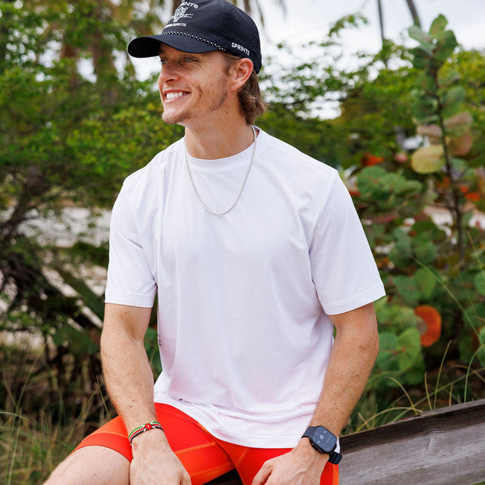 Man wearing the Core Zero Tech Tee in Vault Jag White, close-up