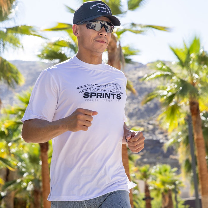 Man wearing the Core Zero Tech Tee in Velocity Sprints White, side view