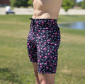 Man wearing the Flexion 8 inch Half Tights in Find the Fauxmingo Black
