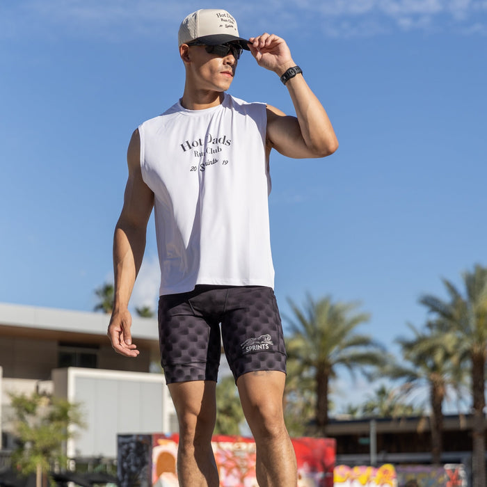Man wearing the Flexion 8 inch Half Tights in Gridlock Grandstand Midnight, side view