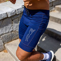 Man wearing the Flexion 8 inch Half Tights in Stealth Navy