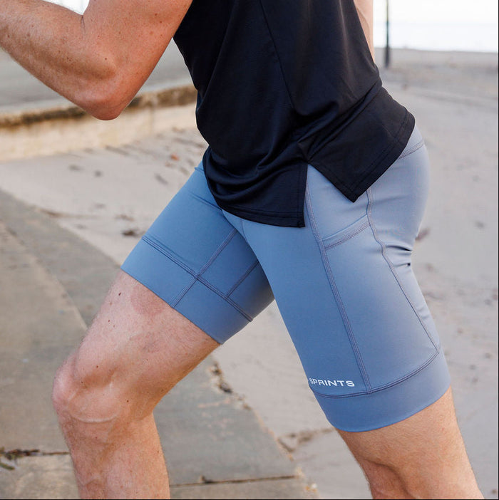 Man wearing the Flexion 8 inch Half Tights in Steel Provisions print