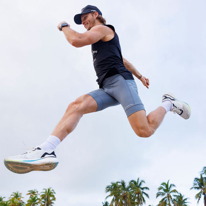 Man wearing the Flexion 8 inch Half Tights in Steel Provisions print, side view
