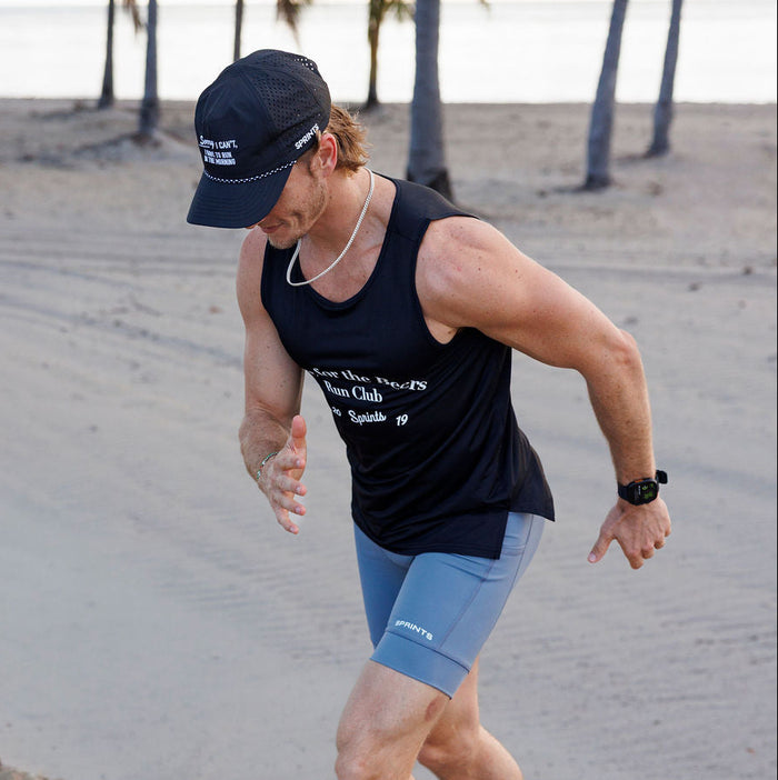 Man wearing the Flexion 8 inch Half Tights in Steel Provisions print, close-up
