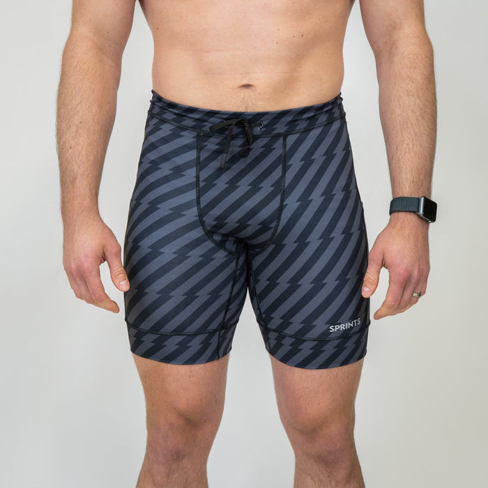 Man wearing the Mens Flexion 8" Half Tights, Velocity Blitz Black