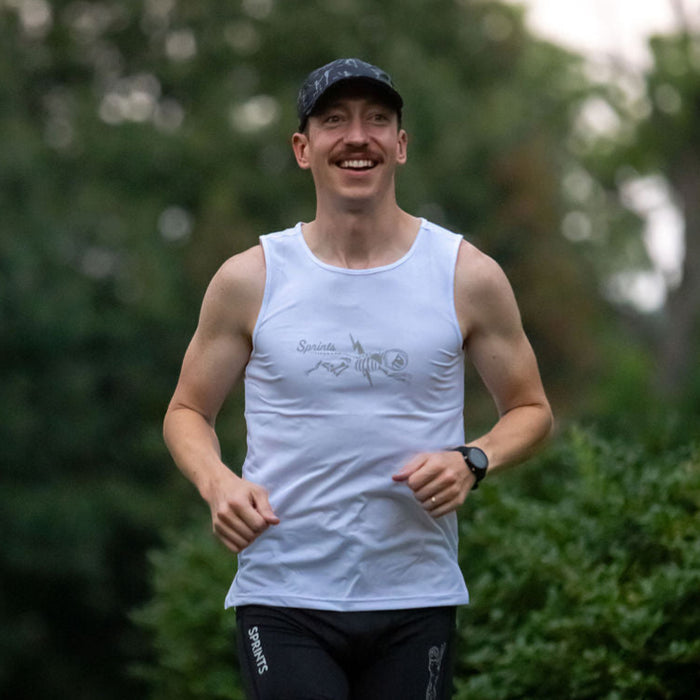 Man wearing the Shock Beast Miles Flash Reflective Running Tank