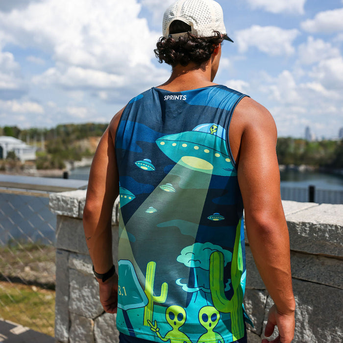 Man wearing the Uninvited Alien Antics Running Tank, close-up