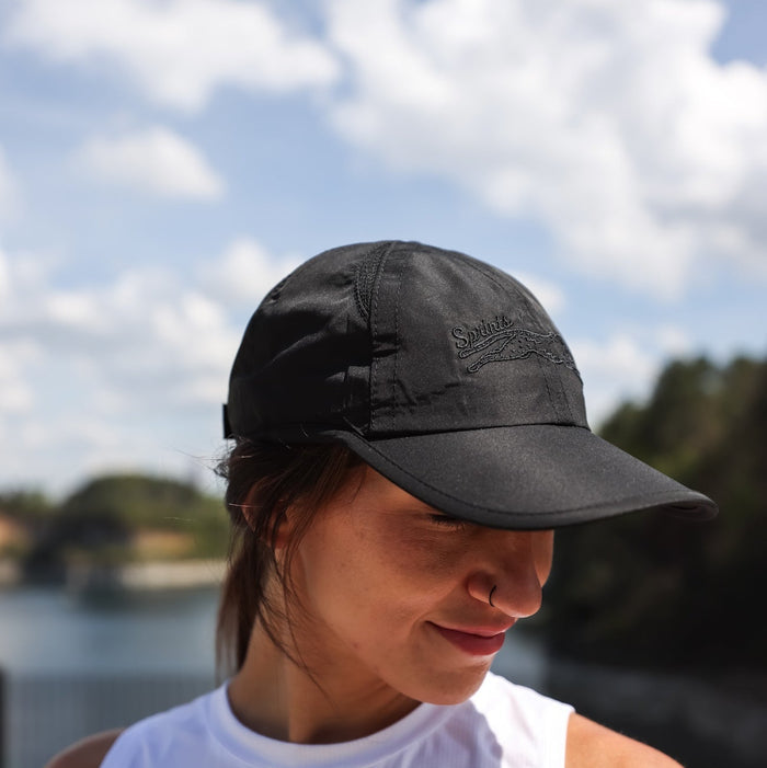 Woman wearing the Midnight Mile OG hat - front view