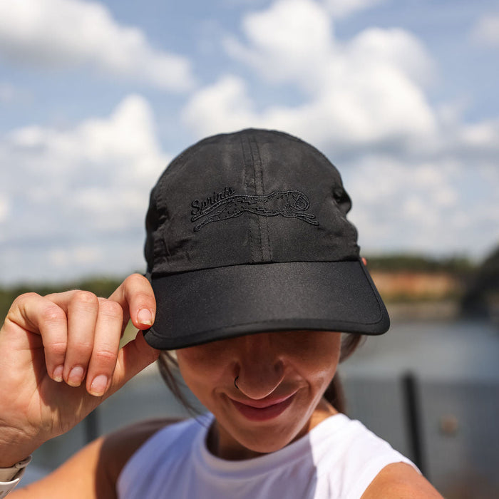 Person wearing the Midnight Mile OG hat outdoors