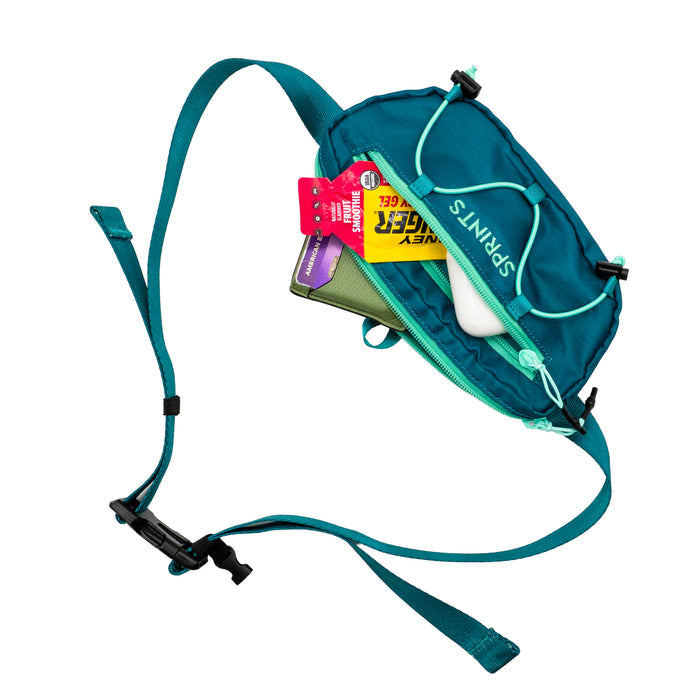 Person wearing the Mile Marker Teal Sling It Bag, outdoors
