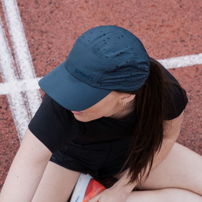 Person wearing the Navy Procrastination Operation HyperG hat