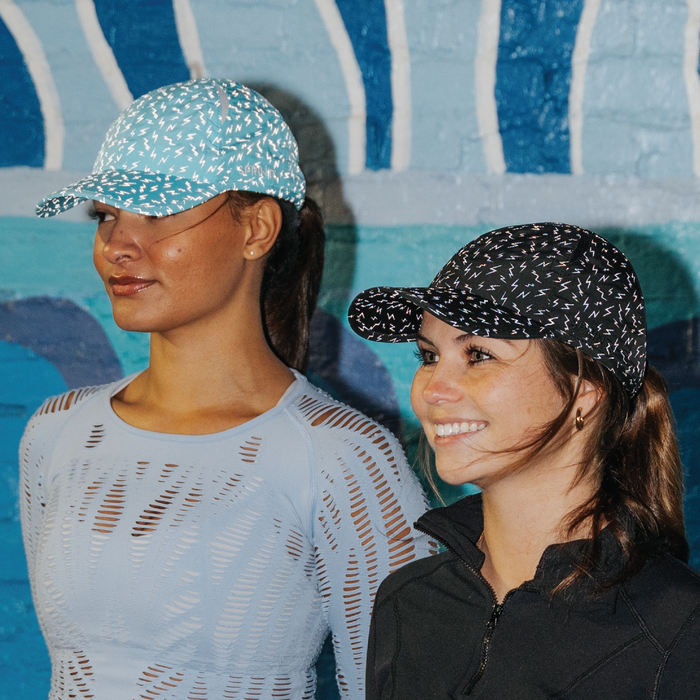 Runner wearing the Nocturnal Not So Neon Flash Reflective OG hat