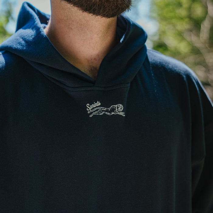 Person wearing the Oversized Hoodie in Streamline print, side view