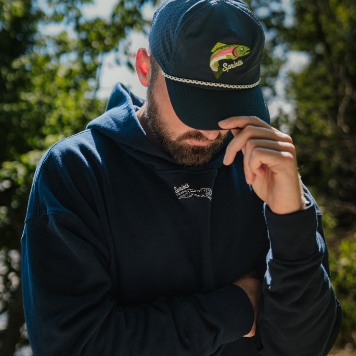Person wearing the Oversized Hoodie in Streamline print, close-up