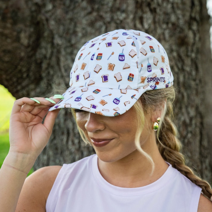 Runner wearing the Peanut Butter Jelly Timed OG Hat