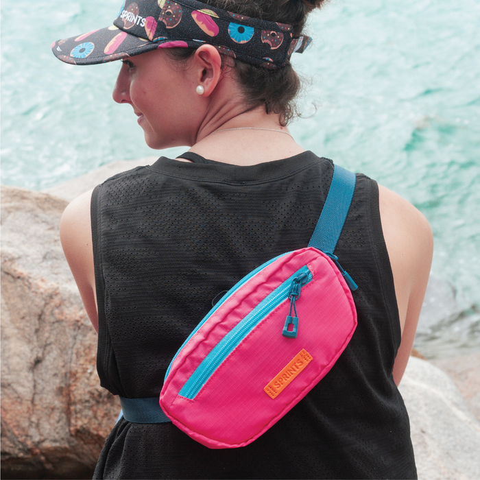 Person wearing the Phuket Fuschia Sling It Bag