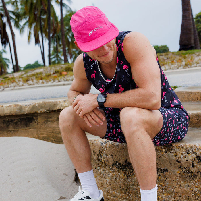 Runner wearing the Powered Up Blaz5 Flat Brim Hat outdoors