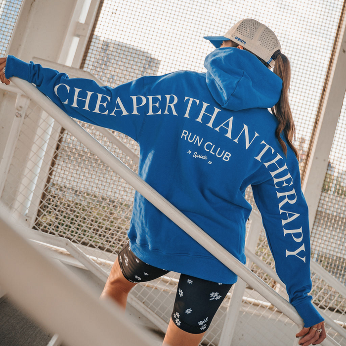 Person wearing the Run Club Oversized Hoodie in Cheaper than Therapy Blue, back view