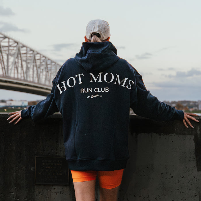 Person wearing the Run Club Oversized Hoodie in Hot Moms Navy