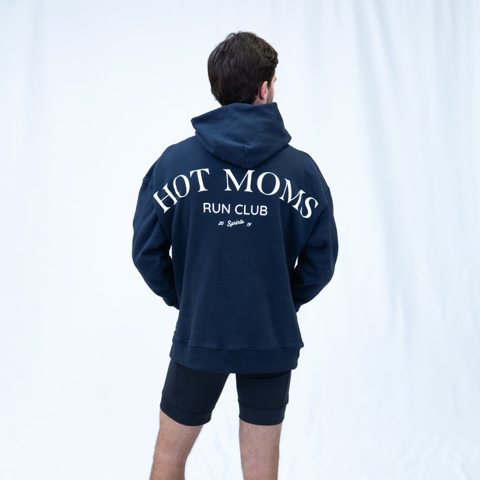 Person wearing the Run Club Oversized Hoodie in Hot Moms Navy, close-up