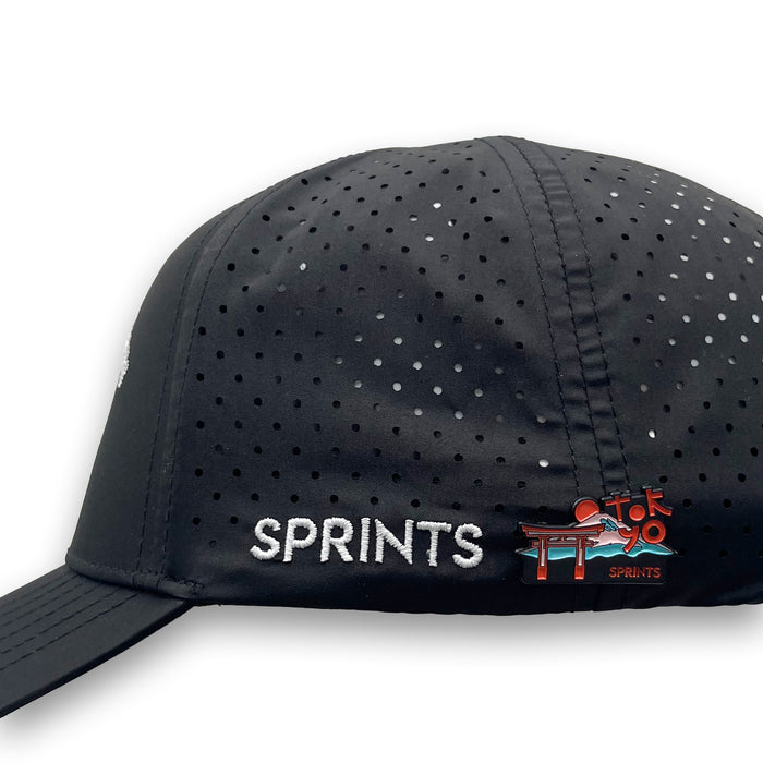 Run Tokyo Enamel Pin attached to a hat brim