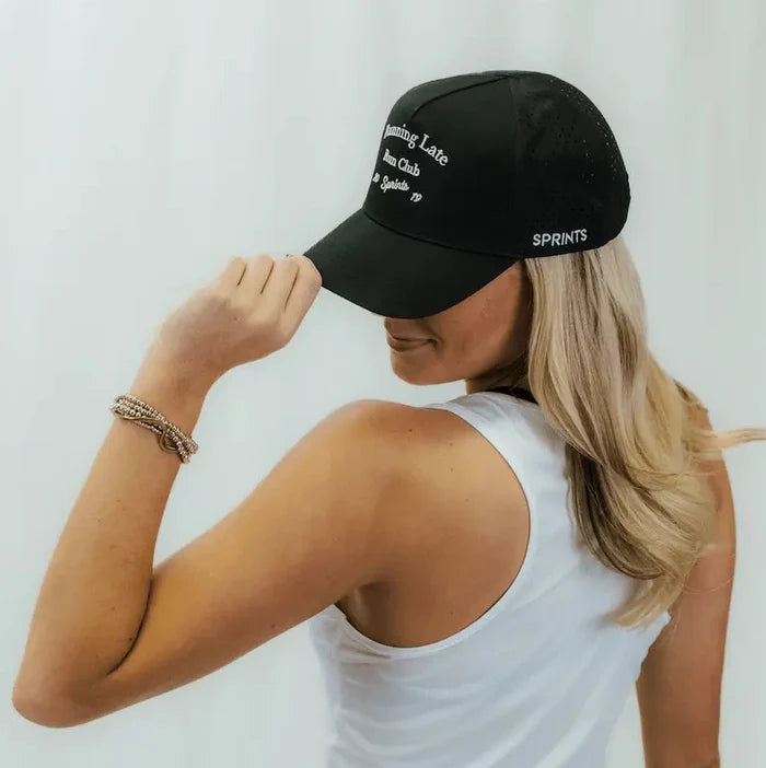 Runner wearing the Running Late Run Club VP Hat