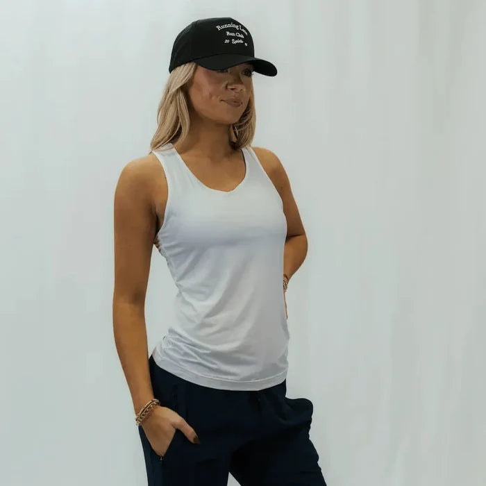 Runner wearing the Running Late Run Club VP Hat outdoors