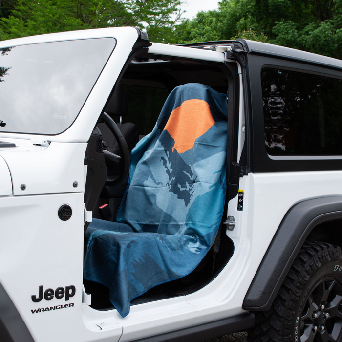 Sasquatch Habitat Car Seat Cover Towel installed on a car seat headrest