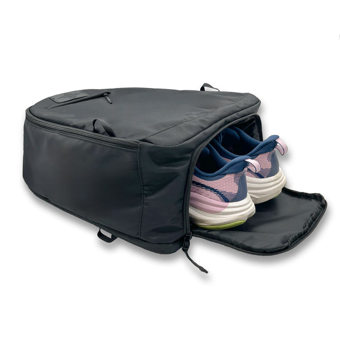 Shadow Noir Bolt Bag Backpack next to running shoes