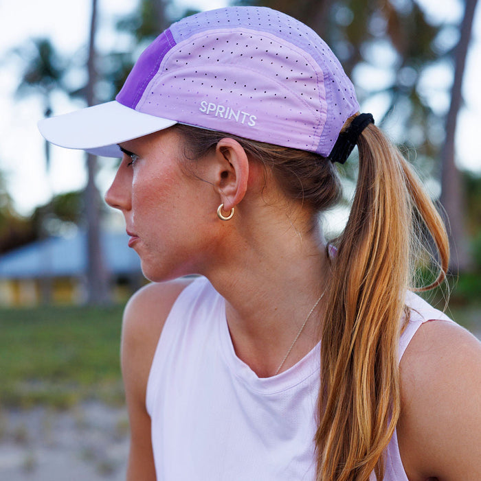 Runner wearing the Smoke Plum HyperG Hat