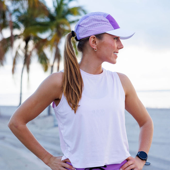 Runner wearing the Smoke Plum HyperG Hat outdoors
