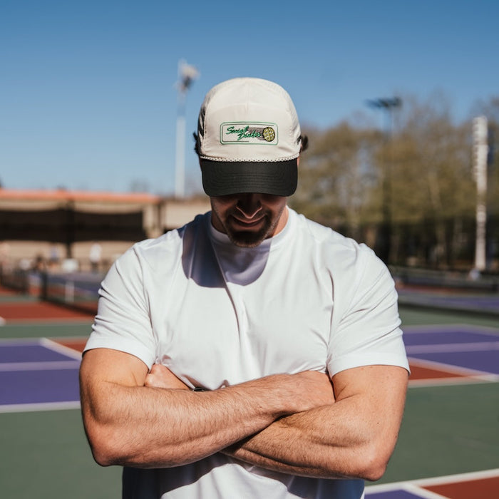 Person wearing the Social Dinker EZ Rope Snapback on the court
