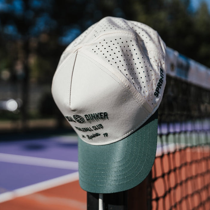 Person wearing the Social Dinker Pickleball Club Structured VP Hat on the court