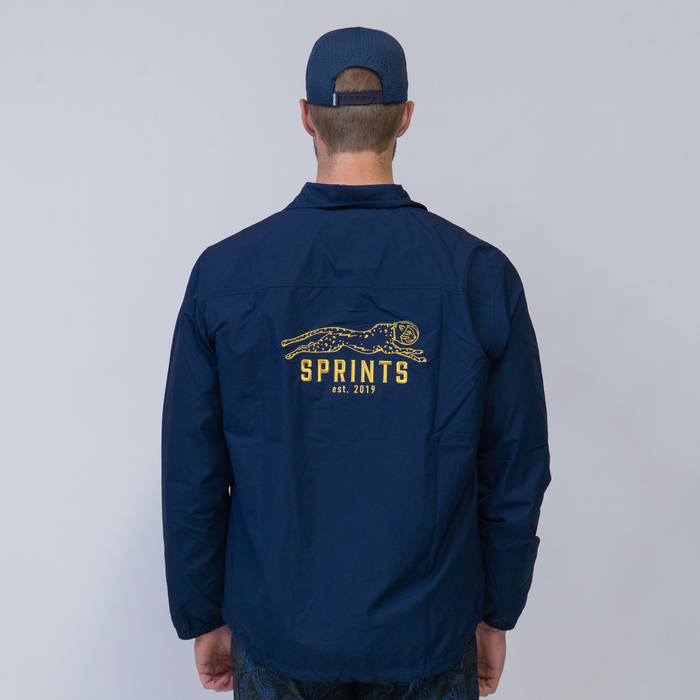 Man wearing the Sprints Coaches Jacket - back view