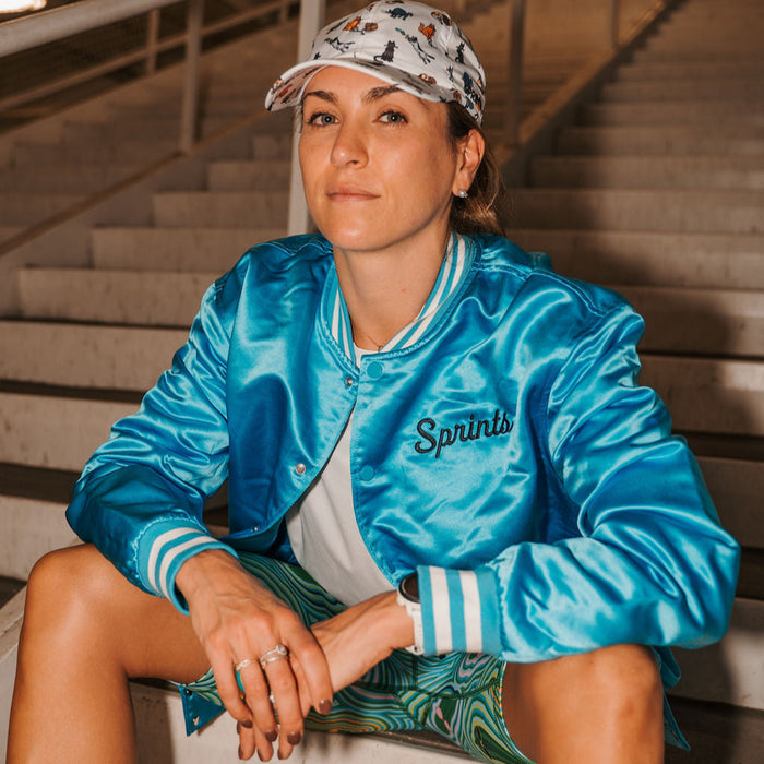 Person wearing the Sprints Running Supply Co Bomber Jacket, close-up