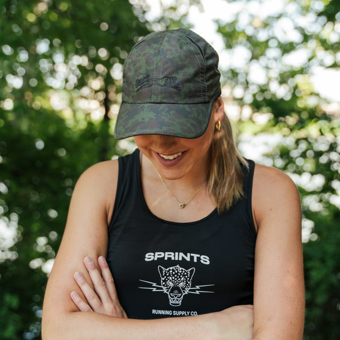 Runner wearing the Range Camo OG Hat