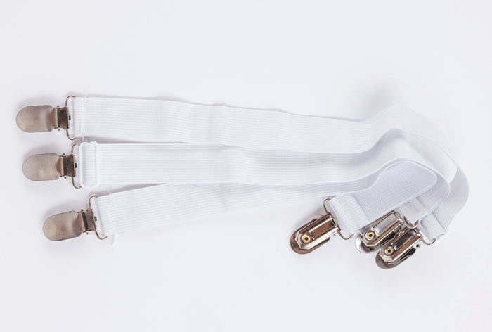 Three white elastic straps with metal clips at both ends, arranged parallel on a white background—perfect for securing Two Side Pillows Sold Separately, featuring washable slipcovers.