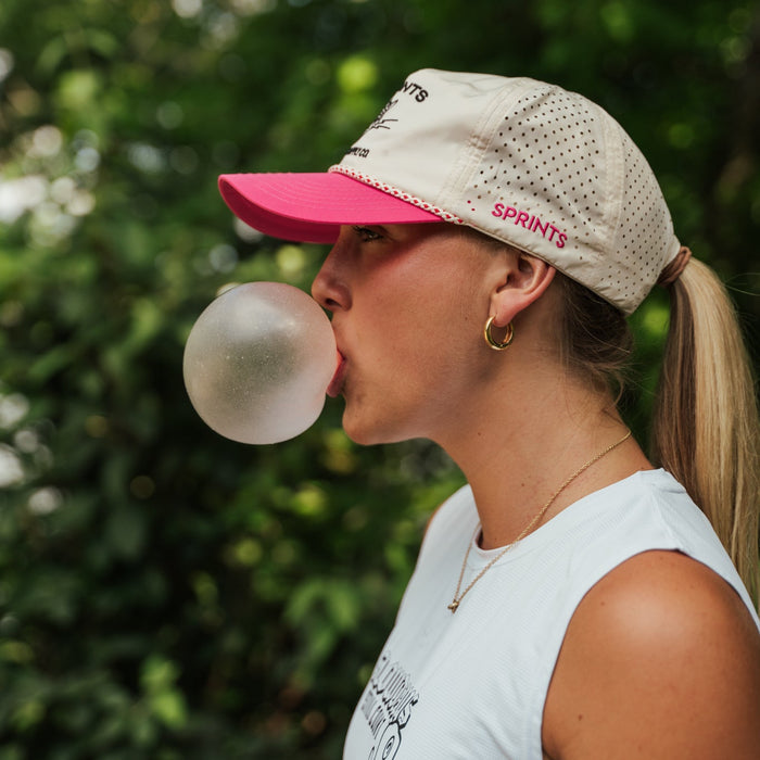 Woman wearing the Vault Jag Sweet & Sweaty EZ Rope Snapback Hat