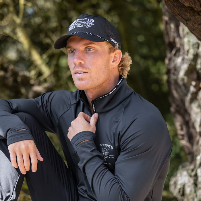 Runner wearing the Velocity Sprints Black EZ Rope Snapback Hat