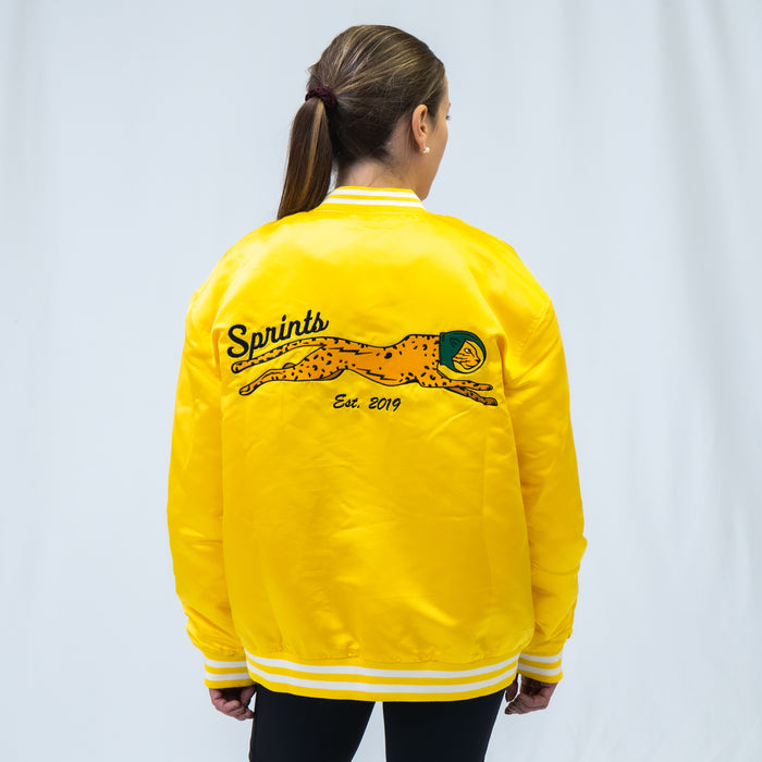 Person wearing the Victory Sprints Bomber Jacket Gold Label, close-up