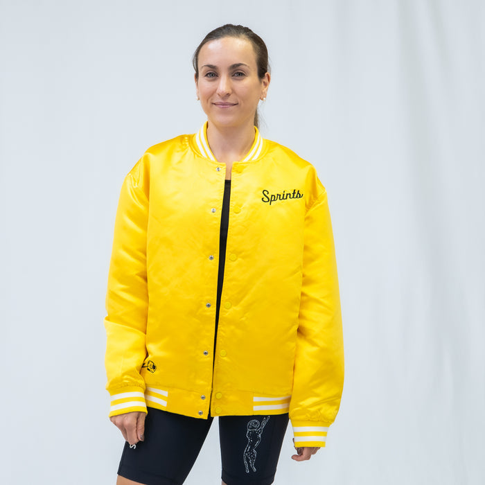 Person wearing the Victory Sprints Bomber Jacket Gold Label, side view