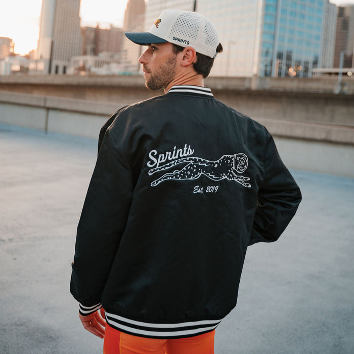 Person wearing the Victory Sprints Bomber Jacket Midnight Mile