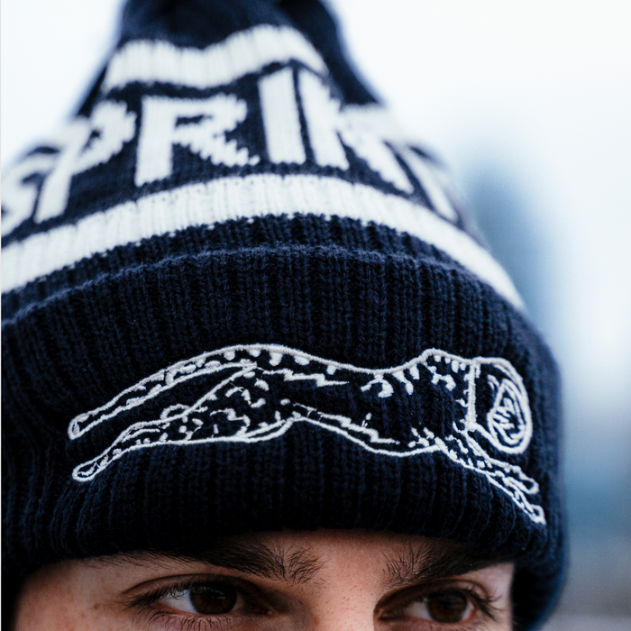 Person wearing the Victory Sprints Classic Winter Hat in Black, close-up