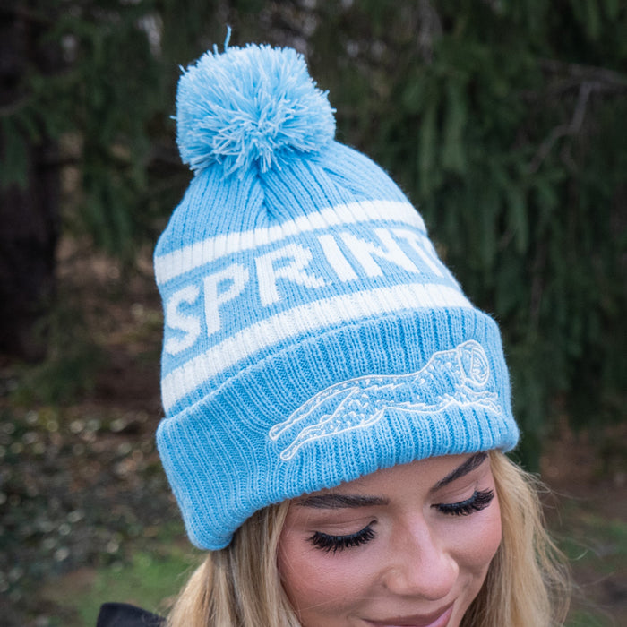 Person wearing the Victory Sprints Classic Winter Hat in Blue, close-up