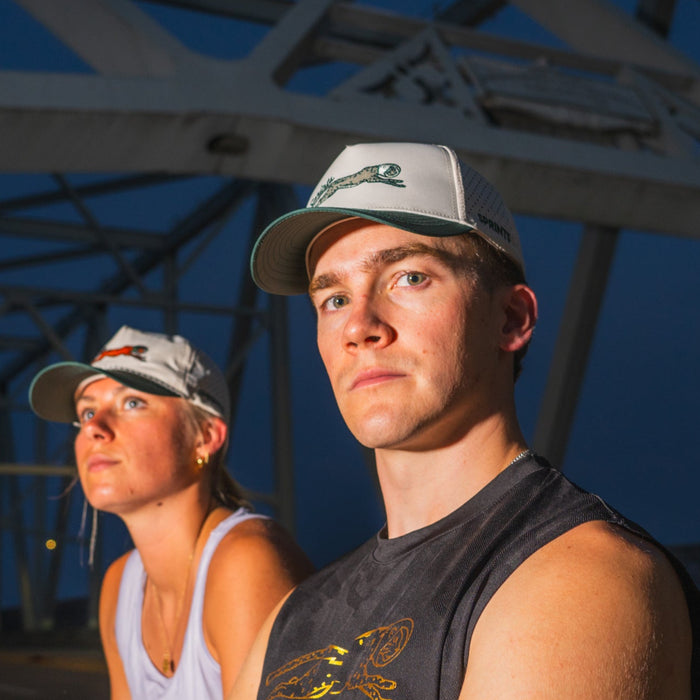Runner wearing the Victory Sprints Green Label Structured VP hat